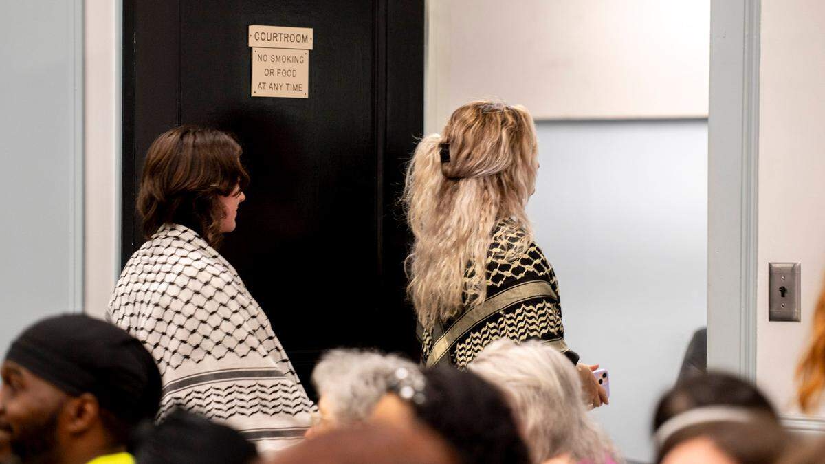 Pro-Palestine protesters exit the court in Chapel Hill on Tuesday, July 30, 2024.