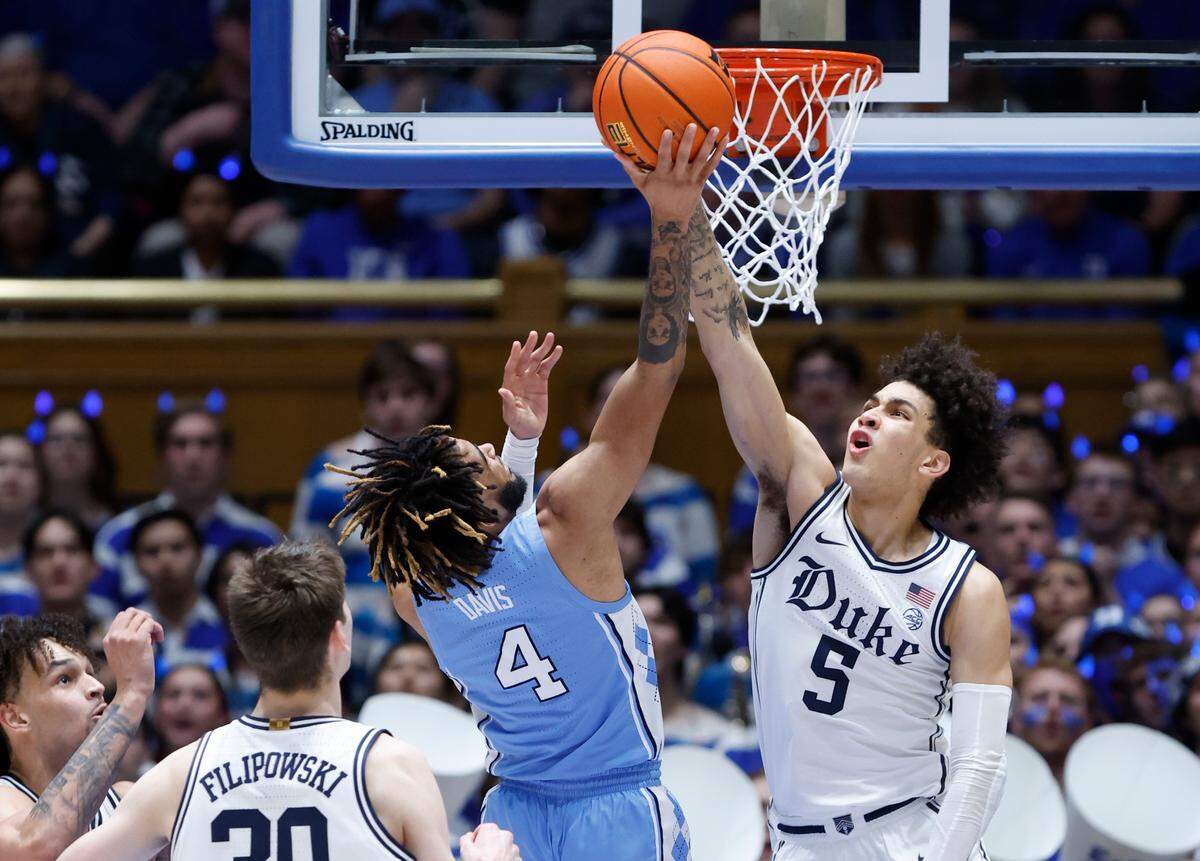 Duke’s Tyrese Proctor (5) blocks the shot by North Carolina’s R.J. Davis (4) late in the second half of Duke’s 63-57 victory over UNC at Cameron Indoor Stadium in Durham, N.C., Saturday, Feb. 4, 2023.