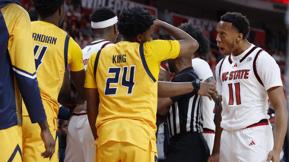 N.C. State’s Quadir Copeland (11) reacts during a scuffle that resulted in the ejection of Tre Holloman in the game against UNC-Greensboro.