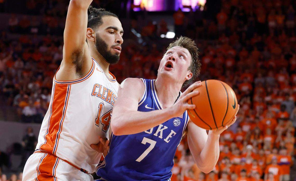 Duke’s Kon Knueppel (7) looks to shoot as Clemson’s Christian Reeves (14) defends during the first half of Duke’s game against Clemson at Littlejohn Coliseum in Clemson, S.C., Saturday, Feb. 8, 2025.