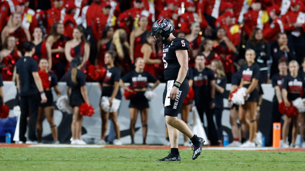 N.C. State quarterback Brennan Armstrong (5) walks off the field after throwing an interception in the final minute of Louisville’s 13-10 victory over N.C. State at Carter-Finley Stadium in Raleigh, N.C., Friday, Sept. 29, 2023.