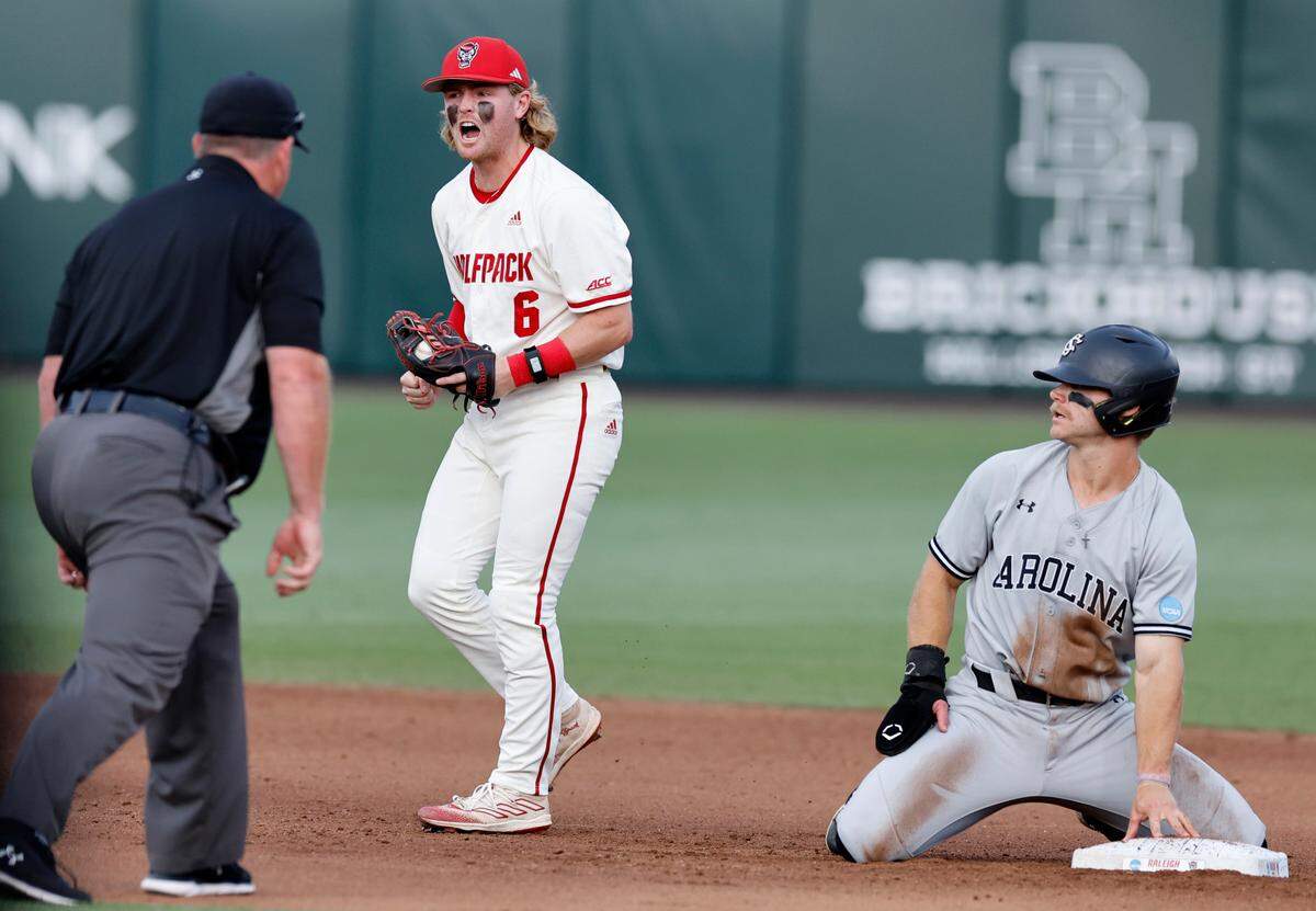 N.C. State’s Matt Heavner (6) celebrates after tagging out South Carolina’s Blake Jackson (6) to complete the double play in the sixth inning during the Wolfpack’s 6-4 victory over South Carolina in the NCAA Raleigh Regional at Doak Field Saturday, June 1, 2024.