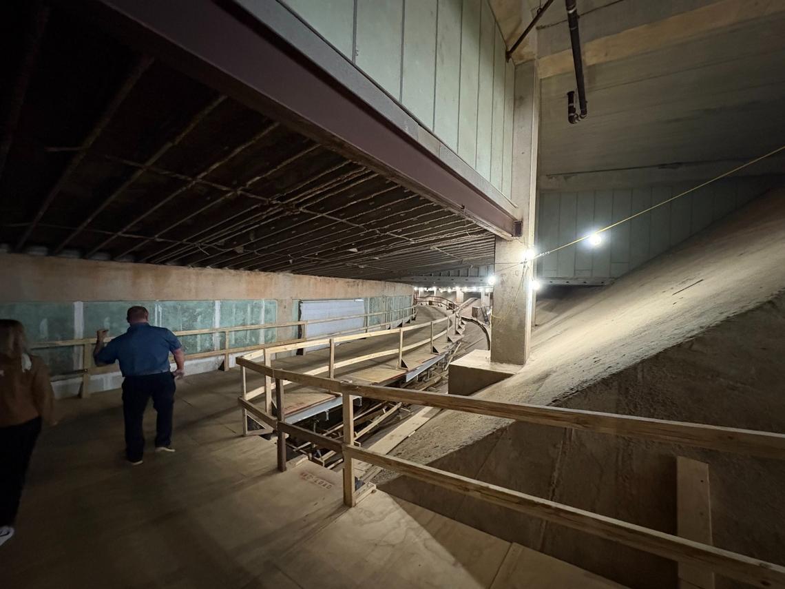 Hundreds of feet of scaffolding inside Lenovo Center allows contractors to move concrete and dirt out and pump new concrete in without disturbing arena events. As part of $300 million in renovations to the arena, contractors are carving out new space for mechanical equipment under the arena.