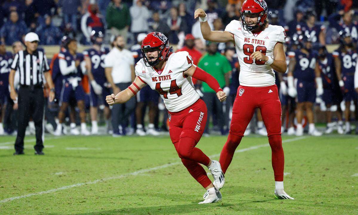 N.C. State place kicker Brayden Narveson (44) celebrates after hitting a 33-yard field goal to give N.C. State a 24-21 victory over Virginia at Scott Stadium in Charlottesville, Va., Friday, Sept. 22, 2023.