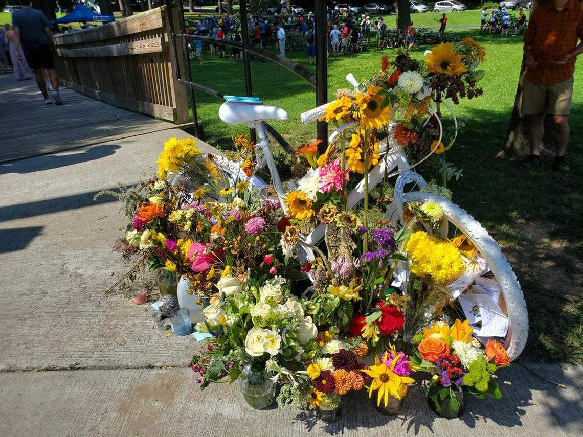 A “ghost bike” roadside memorial is on Guess Road in Durham where bicyclist Matt Simpson was struck by a hit-and-run driver and died four days later from his injuries. Bike Durham organized a Ride of Silence on July 24, 2022, two weeks after Simpson was killed.