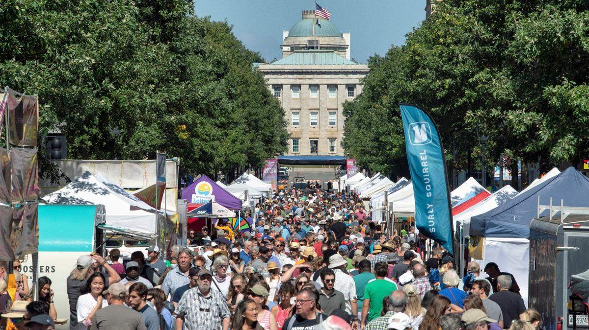 Bluegrass music fans and spectators pack Fayetteville Street in downtown Raleigh on Oct. 2, 2021, for the IBMA Bluegrass Live! festival.