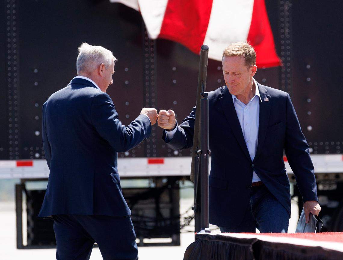 Michael Whatley, then chair of the Republican National Committee, fist bumps U.S. Sen. Ted Budd during a Donald Trump rally in Wilmington on Sept. 21, 2024. 