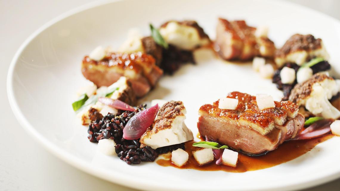 Hawthorne & Wood’s pan-roasted duck breast with a palm sugar glaze is served with forbidden rice, cauliflower and Hosui Asian pear.