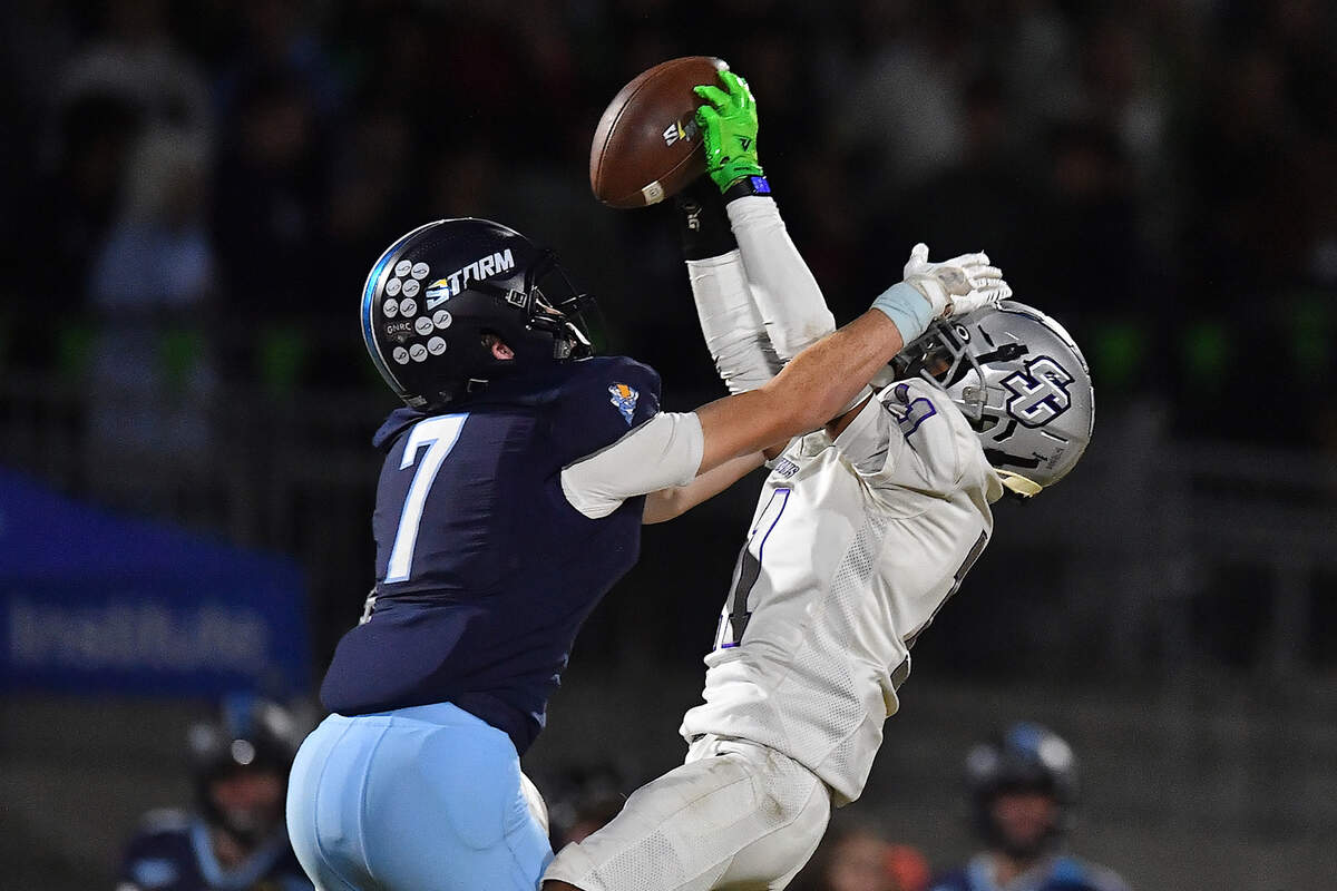 South Garner’s Jaiden Swain (11) makes the interception against Willow Spring’s Luke Maslow (7) during the first half. The Willow Spring Storm and the South Garner Titans met in a football game in Fuquay-Varina. N.C. on October 18, 2024.