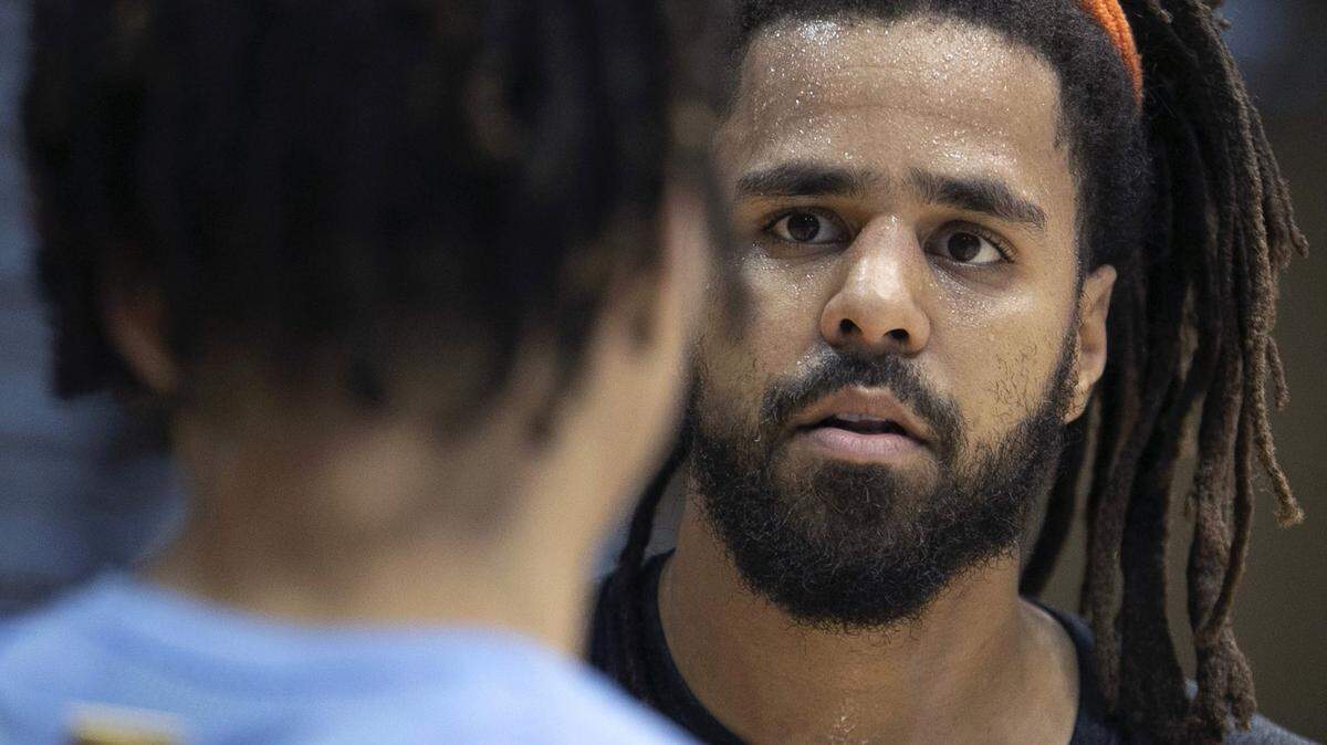 Former UNC guard Cole Anthony meets recording artist J. Cole prior to the Tar Heels’ media day in 2019. J. Cole, who is from Fayetteville, will try his hand at professional basketball in Africa.