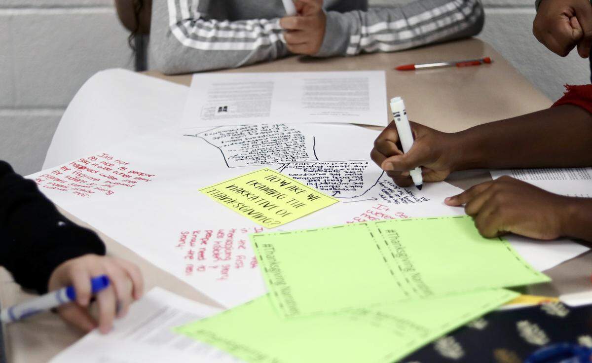 Students work on a mind map about the narrative of Thanksgiving during a lesson on being culturally responsible during Thanksgiving at East Millbrook Middle School in Raleigh, N.C. on November 22, 2019.