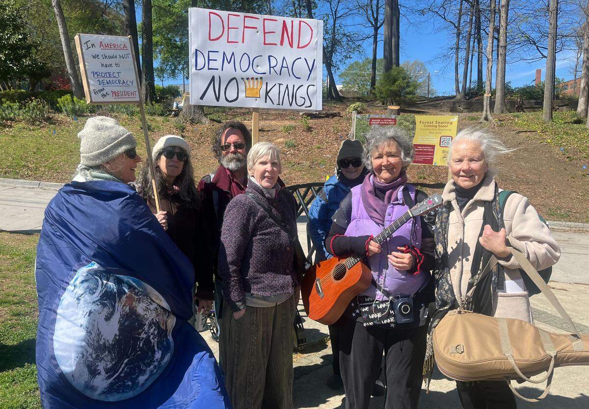 Kathleen Hannan (second from right) is the director of the protest singing group Bodies, Voices, and Spirit. Members of her group — along with Durham Resistance Singers — led thousands of protestors in song at Durham’s No Kings protest Saturday.
