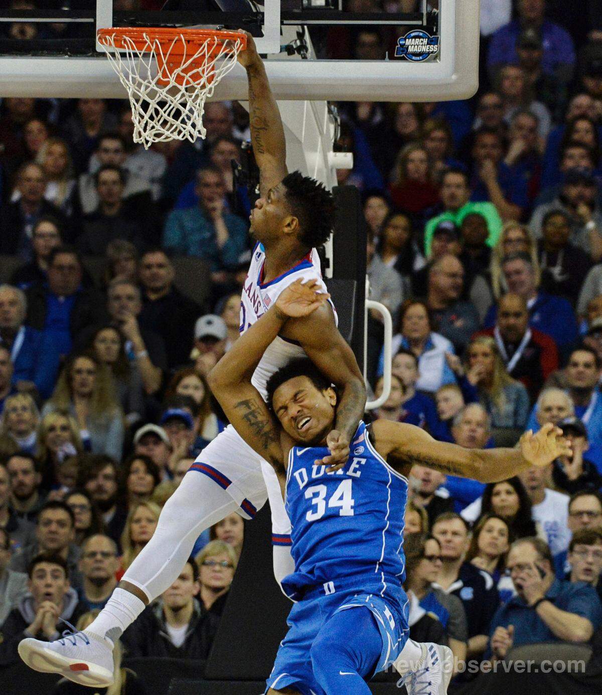Duke forward Wendell Carter Jr (34) gets tangled up with Kansas forward Silvio De Sousa (22) in the first half. Duke played Kansas in the NCAA Elite 8 , Sunday, March 25, 2018 at the CenturyLink Center in Omaha., Neb.