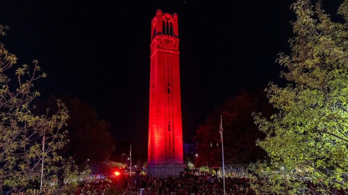 NC State fans celebrate at the Memorial Belltower on campus after the men’s basketball team’s 76-64 win over Duke to advance to the Final Four in the NCAA Men's Division I Basketball Tournament on Sunday, March 31, 2024.