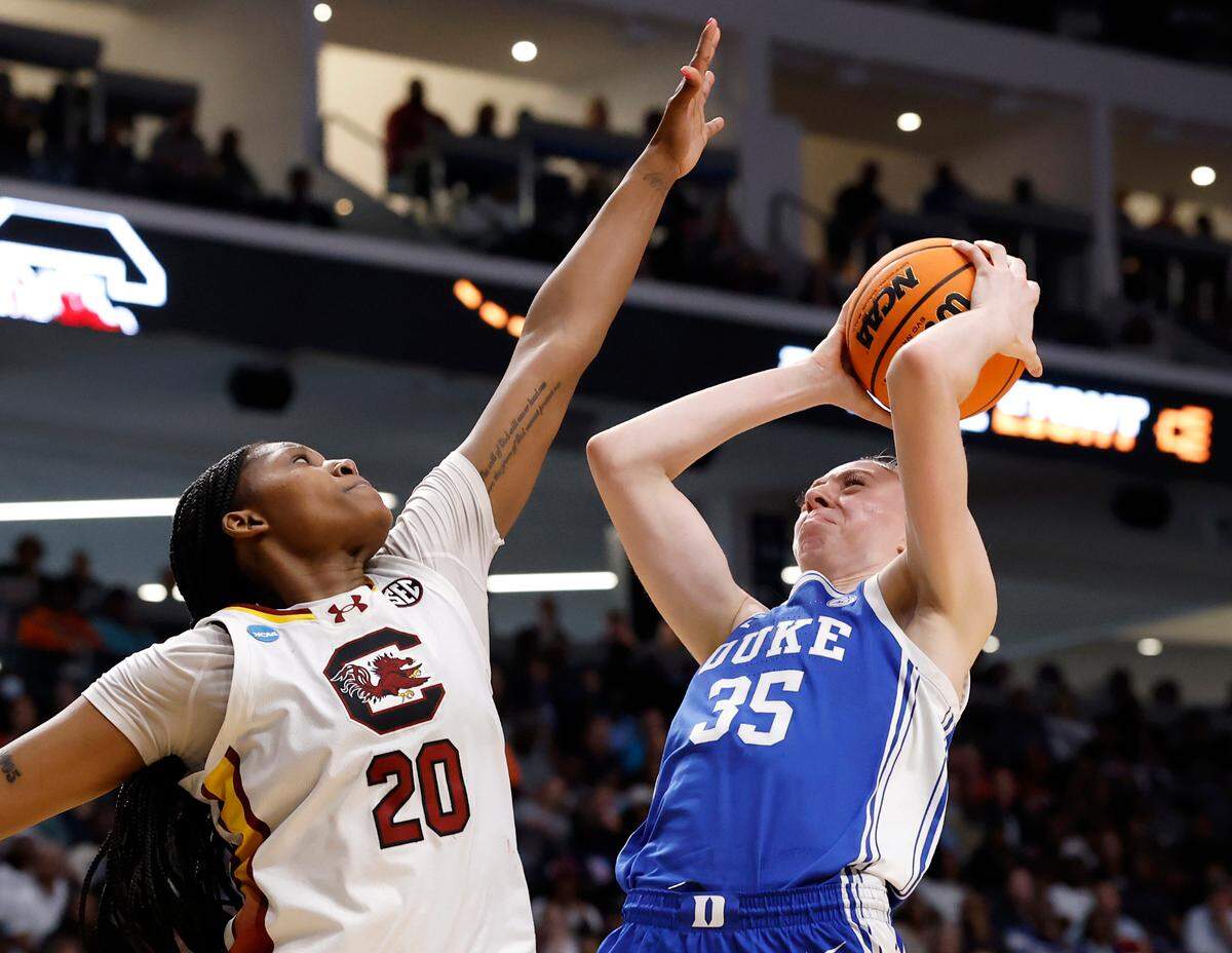 Duke’s Toby Fournier looks to shoot over South Carolina’s Sania Feagin during the first half of the Blue Devils’ 54-50 loss in the NCAA Tournament Elite Eight at Legacy Arena on Sunday, March 30, 2025, in Birmingham, Ala.