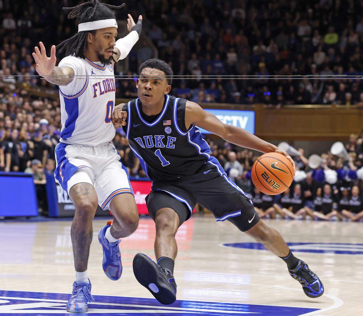 Duke’s Caleb Foster drives past Florida's Boogie Fland during the the Blue Devils’ 67-66 win in the ACC/SEC Challenge on Dec. 2 at Cameron Indoor Stadium.