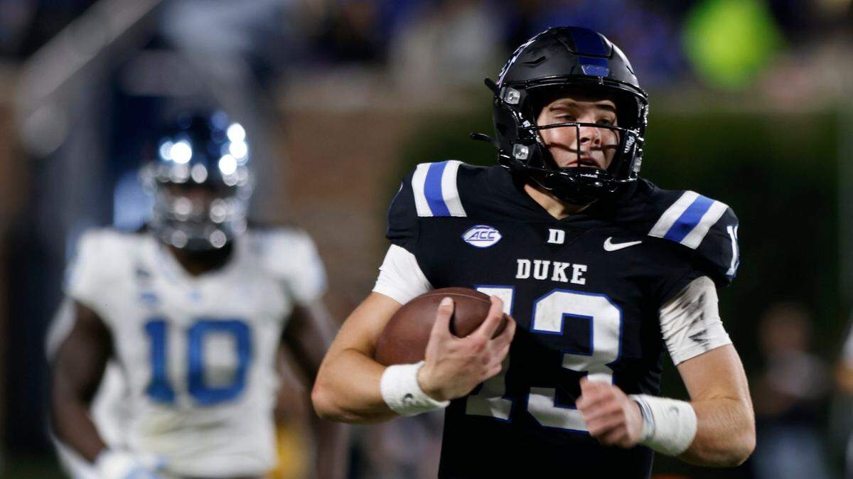 Duke Blue Devils quarterback Riley Leonard (13) runs the ball 74 yards for a touchdown during the first half of the Blue Devils’ game against North Carolina on Saturday, Oct. 15, 2022, at Wallace Wade Stadium in Durham, N.X.