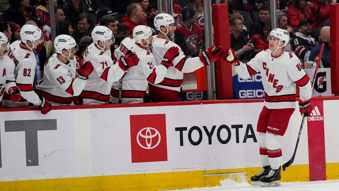 Carolina Hurricanes center Martin Necas, right, celebrates his goal with teammates in the first period of an NHL hockey game against the Washington Capitals, Monday, March 28, 2022, in Washington. (AP Photo/Alex Brandon)