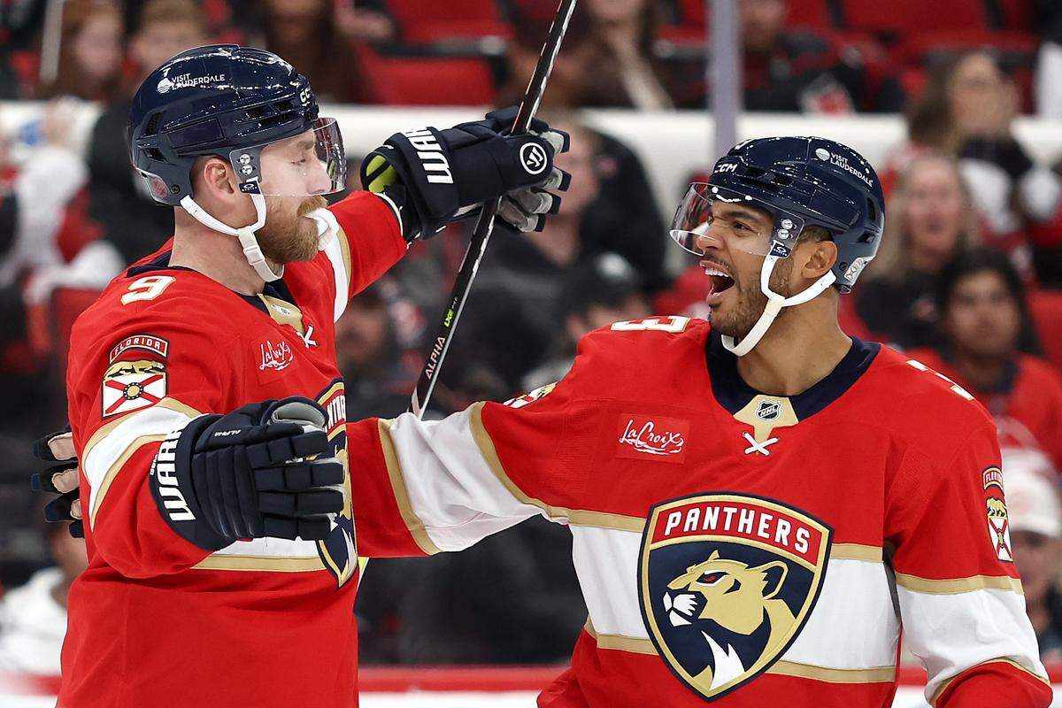 Sam Bennett (9) of the Florida Panthers celebrates with teammate Seth Jones following a goal during the third period against the Carolina Hurricanes at Lenovo Center on Dec. 23, 2025 in Raleigh, North Carolina.