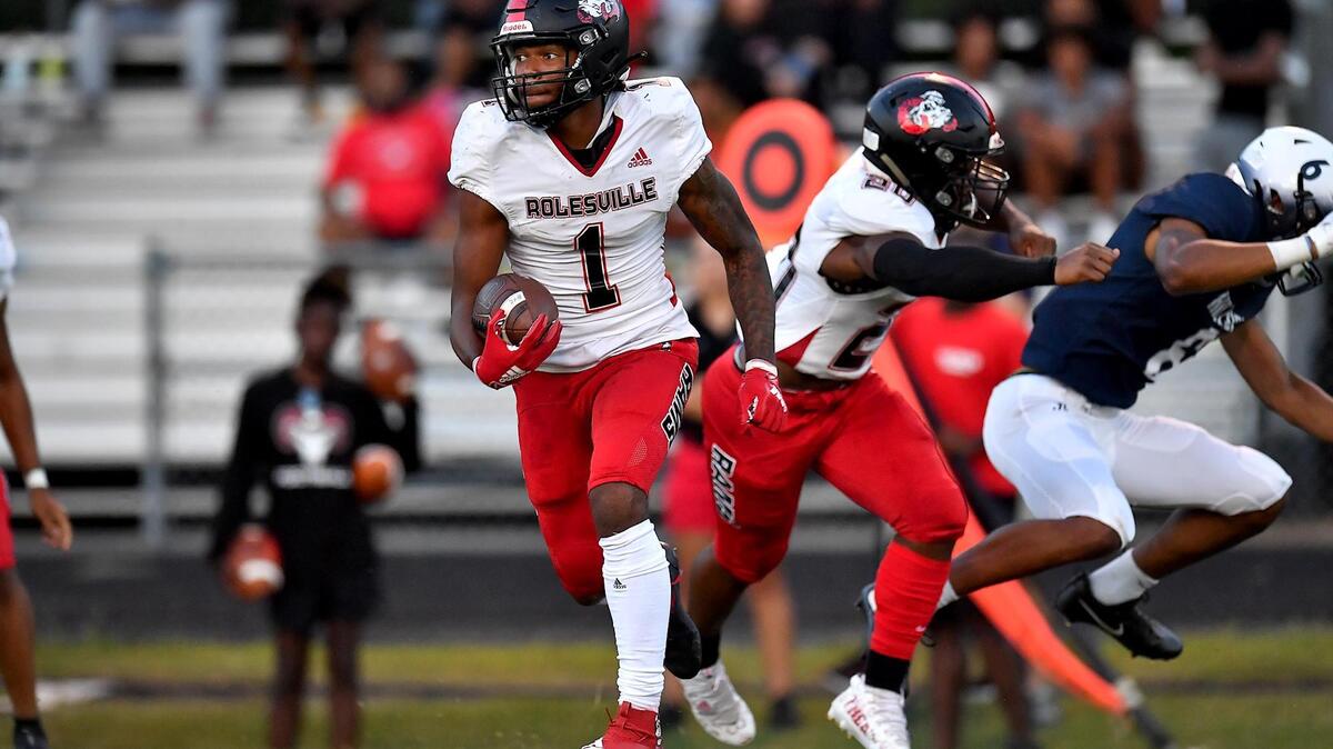 Rolesville’s Tamarcus Cooley (1) runs back the kickoff during the first half against Hillside in Durham, N.C. on Sept. 9.