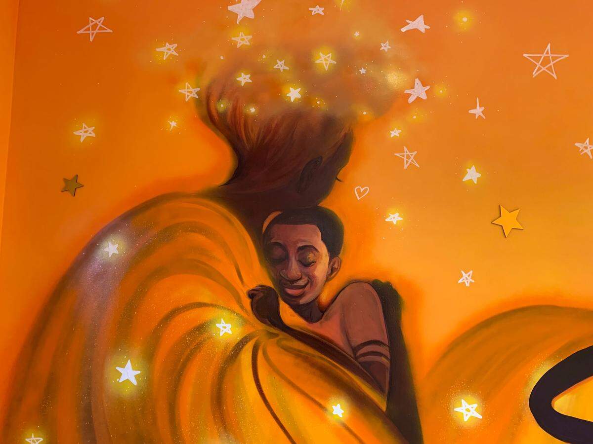 A detail from a mural by Raleigh artist Dare Coulter in the Quality of Life Center in the new UNC Rex Cancer Center in Raleigh. The mural was commissioned by Terrence and Torry Holt, and this image was inspired by their mother, Ojetta, who had cancer when the brothers were young.