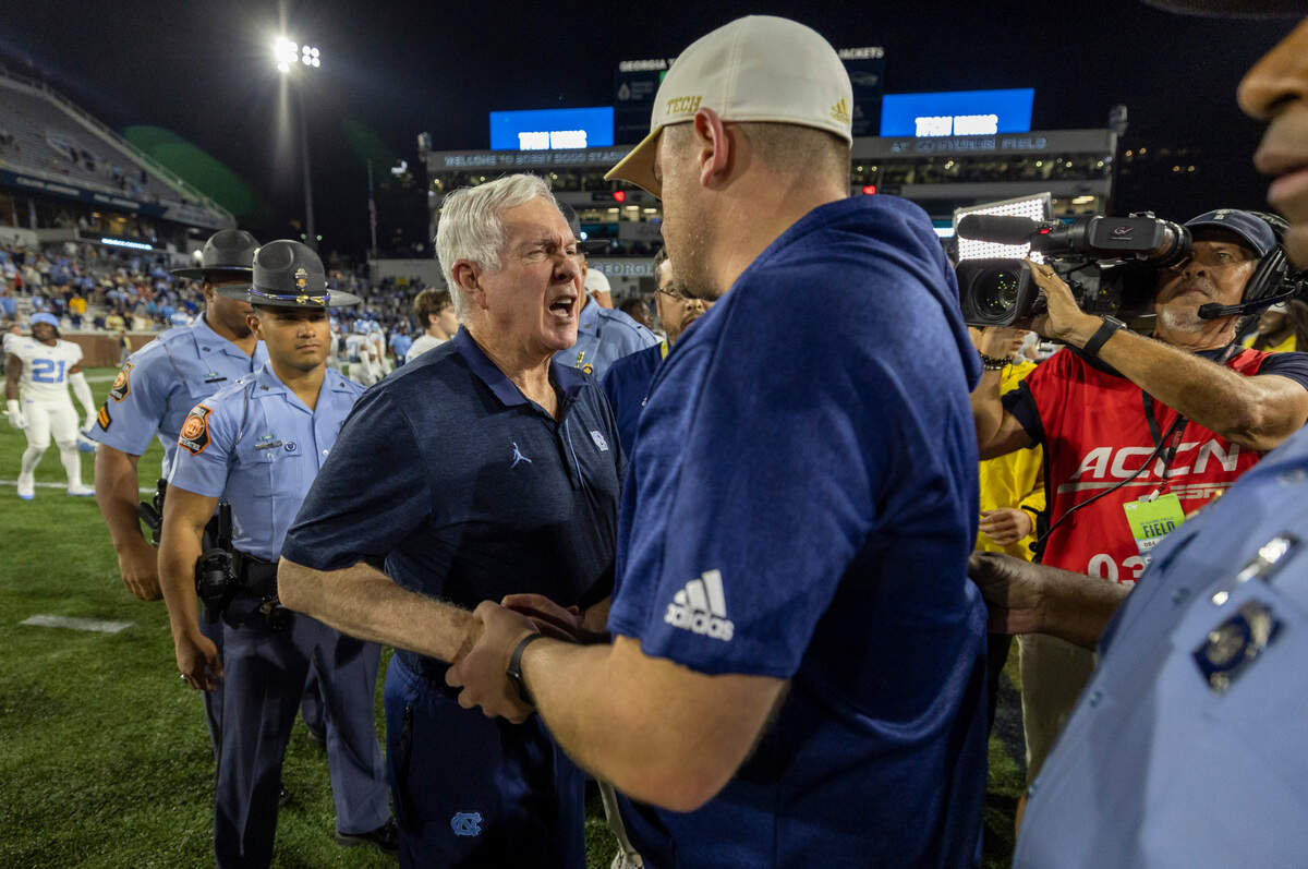 North Carolina coach Mack Brown congratulates Georgia Tech coach Brent Key following the Yellow Jackets’ 46-42 victory on Saturday, October 28, 2023 at Bobby Dodd Stadium in Atlanta, Georgia.