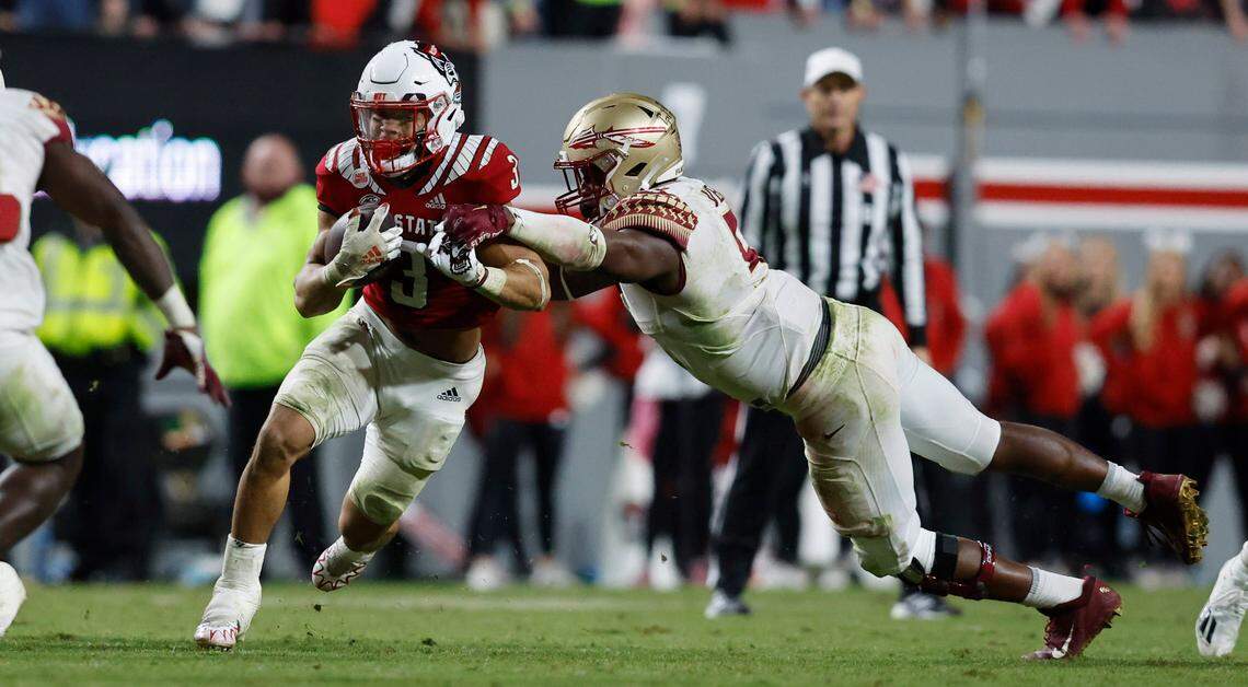 N.C. State running back Jordan Houston (3) breaks free from Florida State defensive lineman Jared Verse (5) during the second half of N.C. State’s 19-17 victory over Florida State at Carter-Finley Stadium in Raleigh, N.C., Saturday, Oct. 8, 2022.
