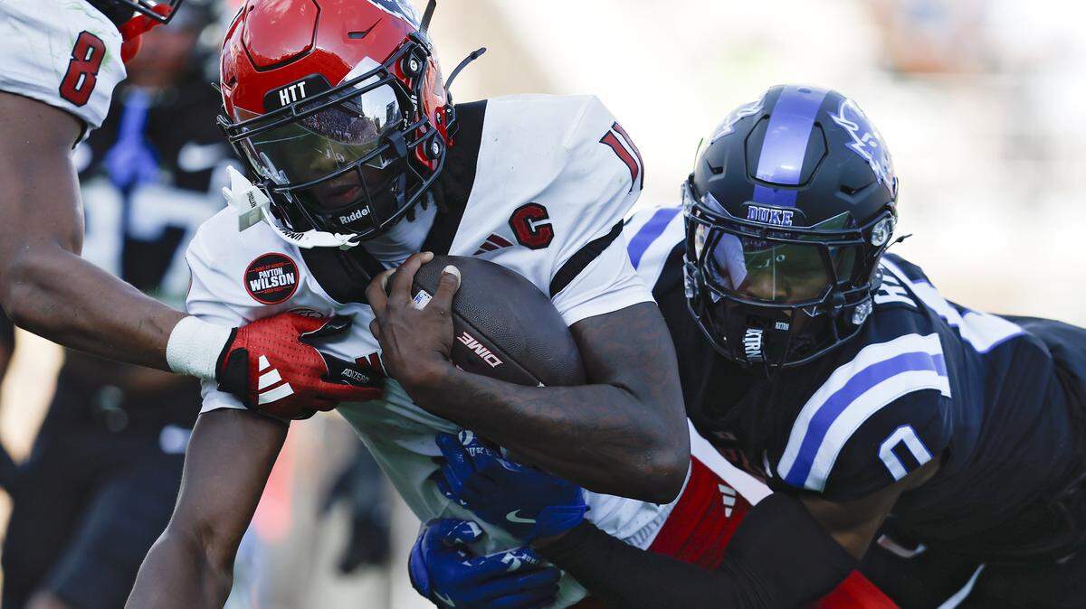 Duke’s Chandler Rivers tackles N.C. State quarterback CJ Bailey during the first half of the Blue Devils’ game on Saturday, Sept. 20, 2025, at Wallace Wade Stadium in Durham, N.C.