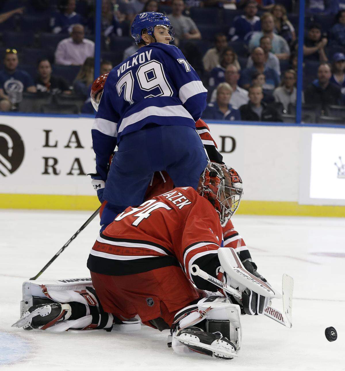 Carolina Hurricanes goaltender Petr Mrazek makes a pad save on a deflection by Tampa Bay Lightning right wing Alexander Volkov on Monday.