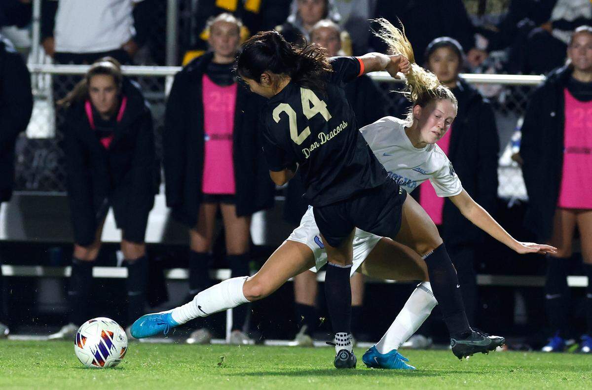 North Carolina’s Maddie Dahlien (5) collides with Wake Forest’s Zara Chavoshi (24) as they fight for the ball during the second half of UNC’s 1-0 victory over Wake Forest in the finals of the 2024 Women’s College Cup at WakeMed Soccer Park in Cary, N.C., Monday, Dec. 9, 2024.