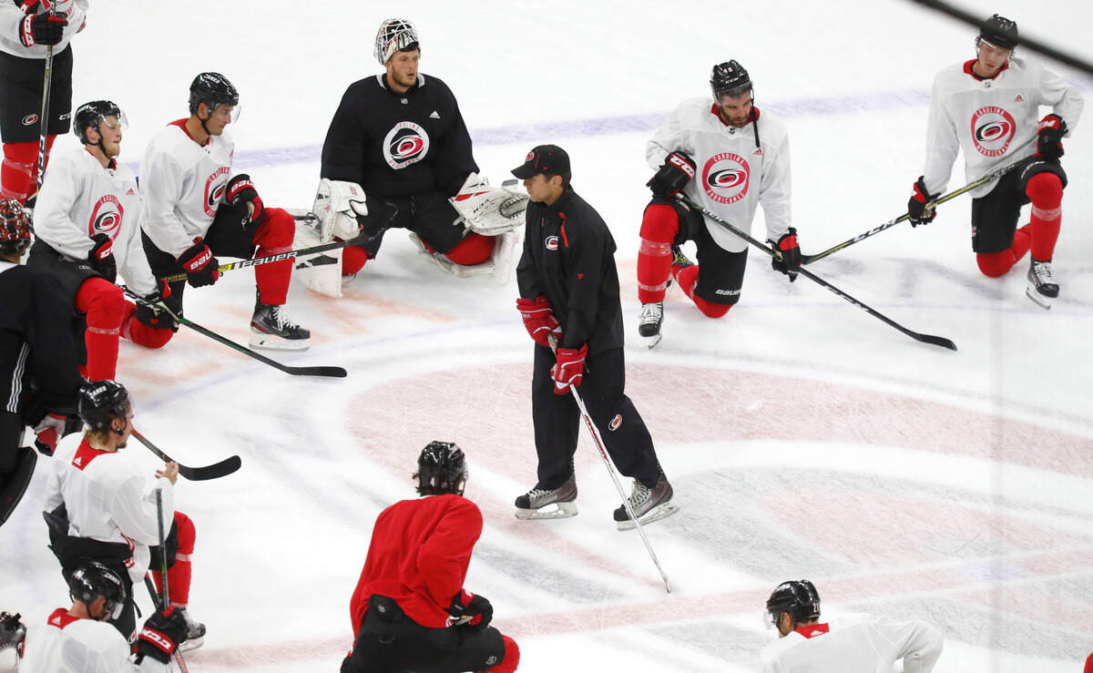 Carolina head coach Rod Brind’Amour talks with the players at the end of the Carolina Hurricanes’ practice at PNC Arena in Raleigh, N.C., Wednesday, July 22, 2020.