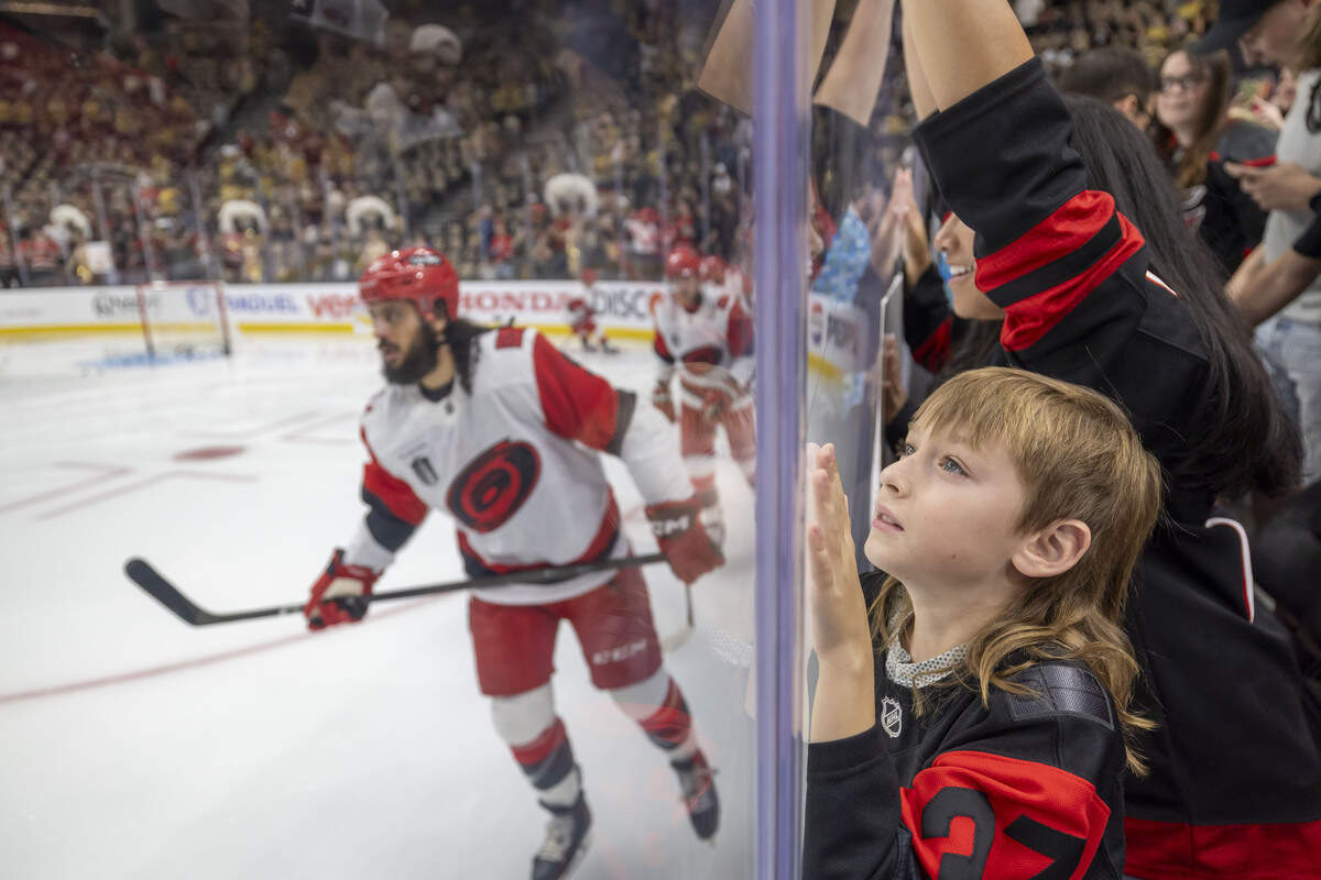 Reign Haithcock presses against the glass, as he watches the Carolina Hurricanes warm up for Game 3 of the Stanley Cup Final against the Vegas Golden Knights, on Saturday, June 6, 2026 at T-Mobile Arena in Las Vegas, NV.