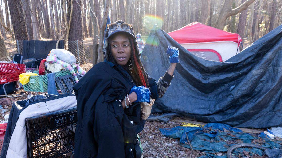 A woman who identified herself as “Sesame” lives in a tent next to the exit ramp from eastbound Interstate 40 onto South Saunders Street in Raleigh. NCDOT is working with police and social service agencies to ensure that people living in the camp have been offered help before clearing the area of trash and debris.