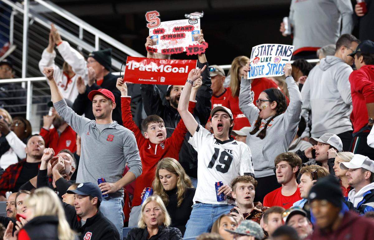 Wolfpack fans cheer during the first half of N.C. State’s game against Kansas State in the Pop-Tarts Bowl at Camping World Stadium in Orlando, Fla., Thursday, Dec. 28, 2023.