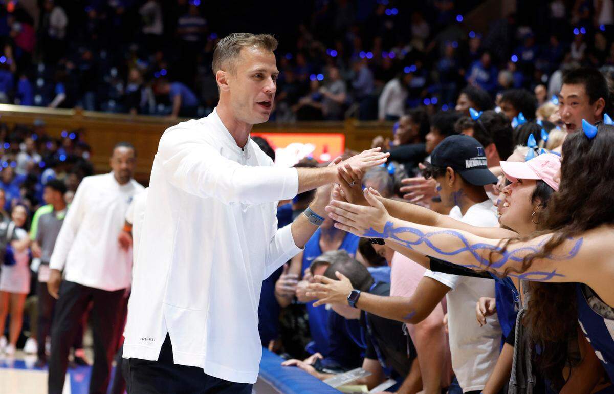Duke head coach Jon Scheyer greets the Cameron Crazies after Duke’s Countdown to Craziness at Cameron Indoor Stadium in Durham, N.C., Friday, Oct. 21, 2022.