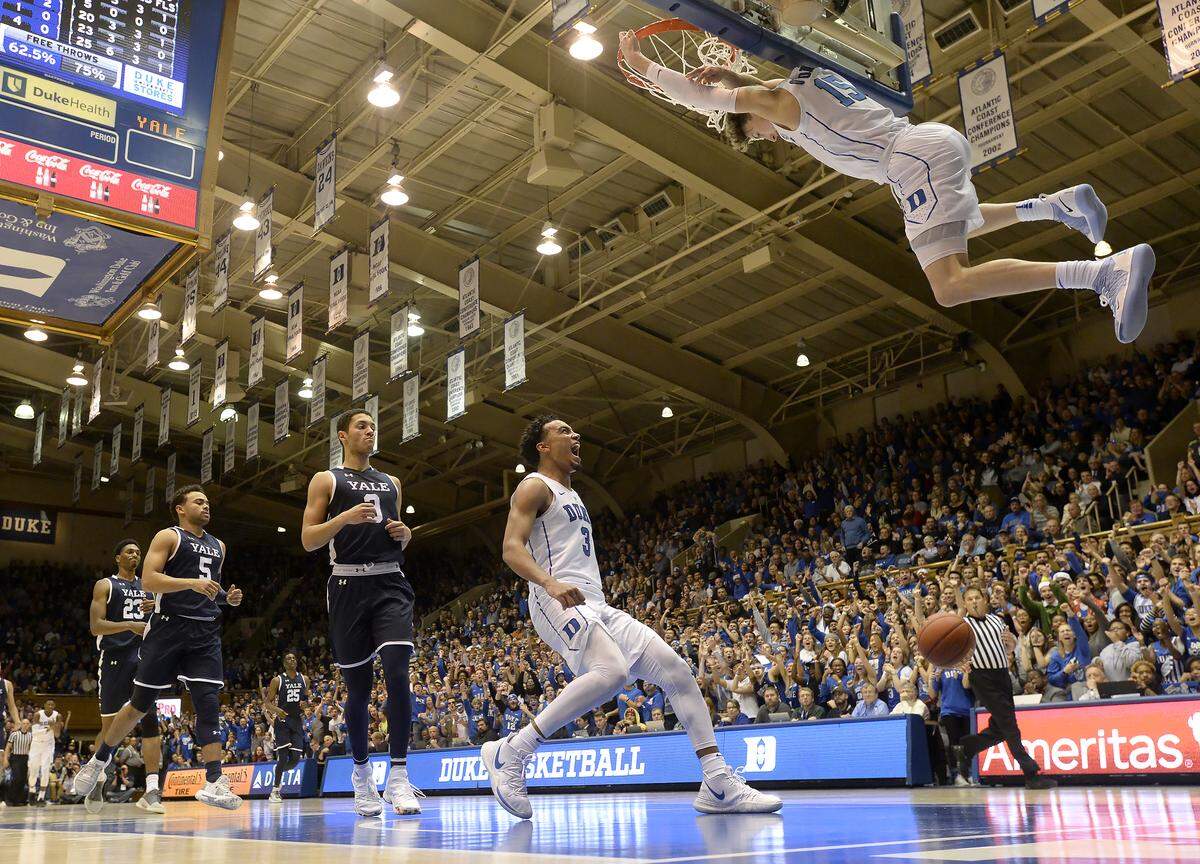 Duke guard Tre Jones (3) reacts as teammate guard Alex O’Connell (15) slams a dunk through the basket against Yale in the first half at Cameron Indoor Stadium In Durham, N.C. Saturday, Dec. 8, 2018.