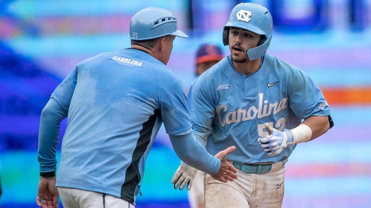 North Carolina coach Scott Forbes congratulates Tomas Frick (52) as he rounds third base, after connecting for a home run in the ninth inning against Clemson during the semi-finals of the 2023 ACC Baseball Championship on Saturday, May 27, 2023 at Durham Bulls Athletic Park in Durham, N.C. The Tar Heels fell 10-4 to Clemson.