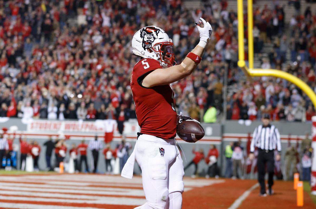 N.C. State wide receiver Thayer Thomas (5) celebrates after scoring on a eight-yard touchdown reception during the second half of N.C. State’s 41-17 victory over Syracuse at Carter-Finley Stadium in Raleigh, N.C., Saturday, Nov. 20, 2021.