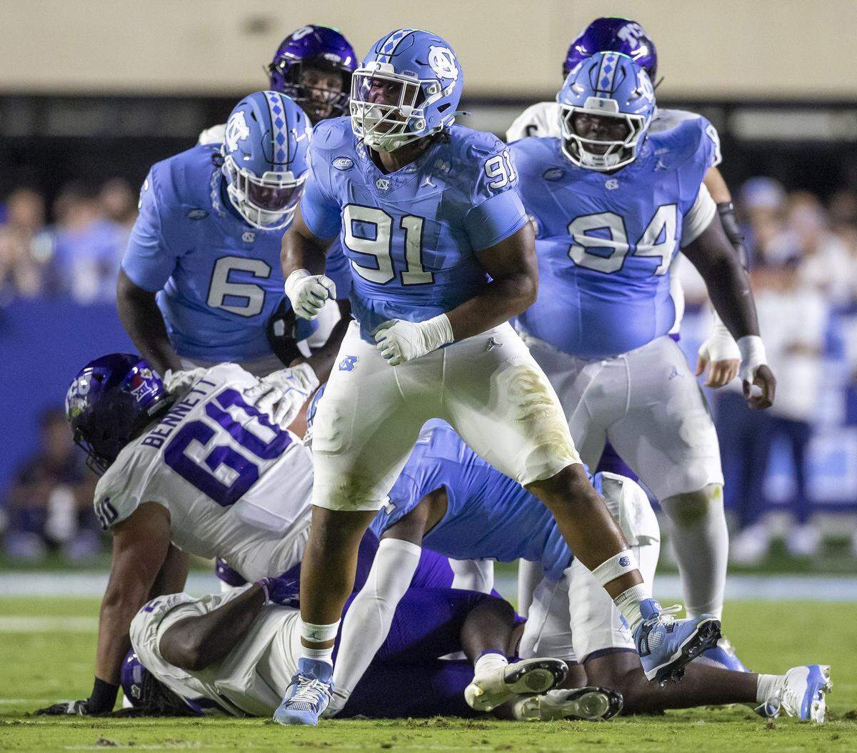 North Carolina defensive lineman Leroy Jackson (91) reacts after stopping Texas Christian running back Kevorian Barnes (2) in the first quarter on Monday, September 1, 2025 in Chapel Hill, N.C.  