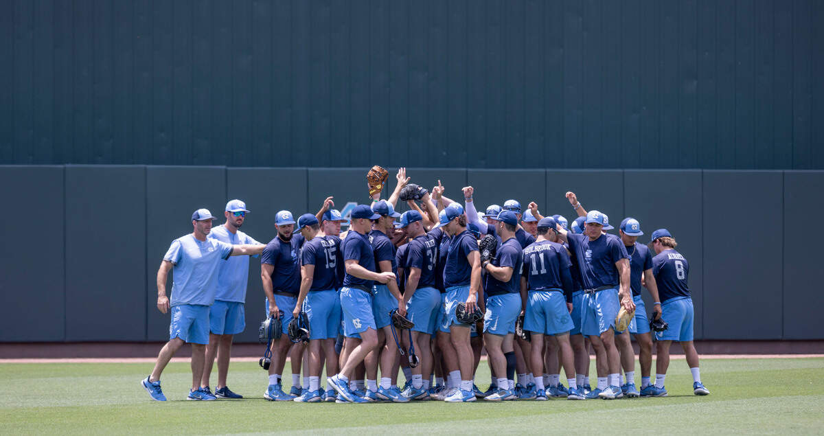 The North Carolina baseball team gathers around head coach Scott Forbes as they begin their workout on Friday, June 10, 2022 at Boshamer Stadium in Chapel Hill, N.C.