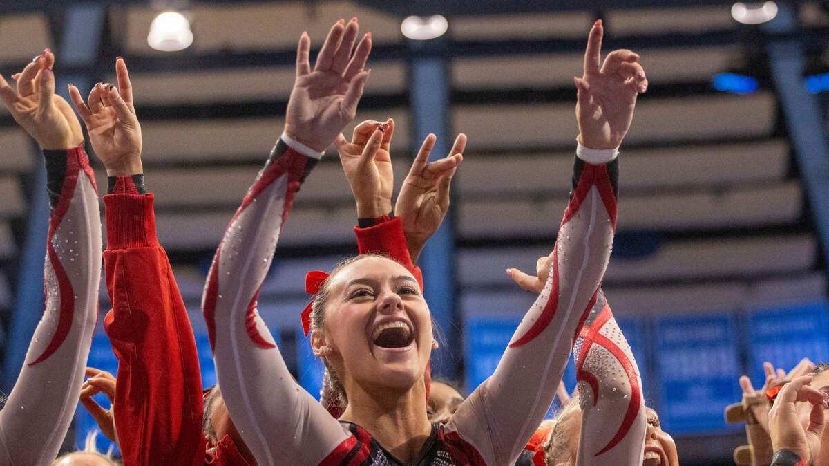 Emily Shepard and the Wolfpack gymnastics team celebrate after beating UNC, 196.225-195.325 on Jan. 19, 2024, in Chapel Hill, N.C.