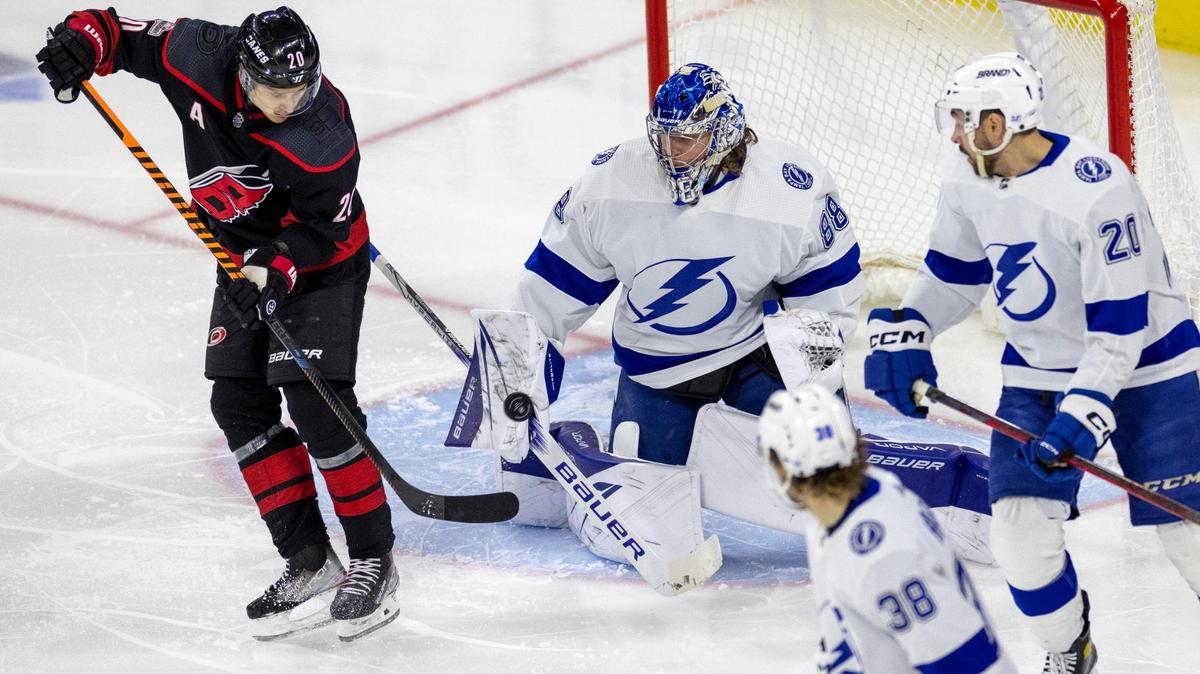 Tampa goalie Andrei Vasilevskiy (88) stops a scoring attempt by Carolina Hurricanes’ Sebastian Aho (20) in the second period on Tuesday, March 28, 2023 at PNC Arena in Raleigh, N.C.