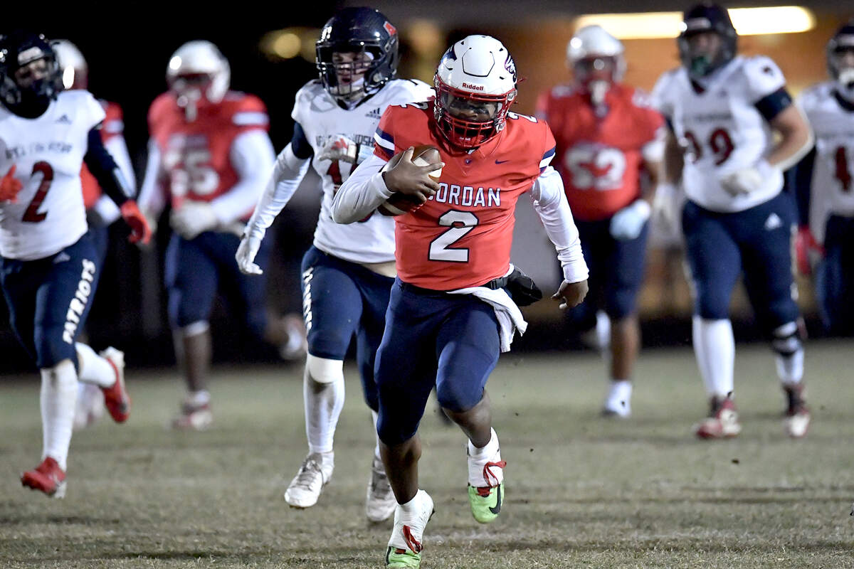 Jordan quarterback Landon Melton (2) runs for the touchdown against Apex Friendship during the second half. The Apex Friendship Patriots and the Durham Jordan Falcons met in the second round of the NCHSAA 4A playoffs in Durham, N.C. on November 22, 2024.