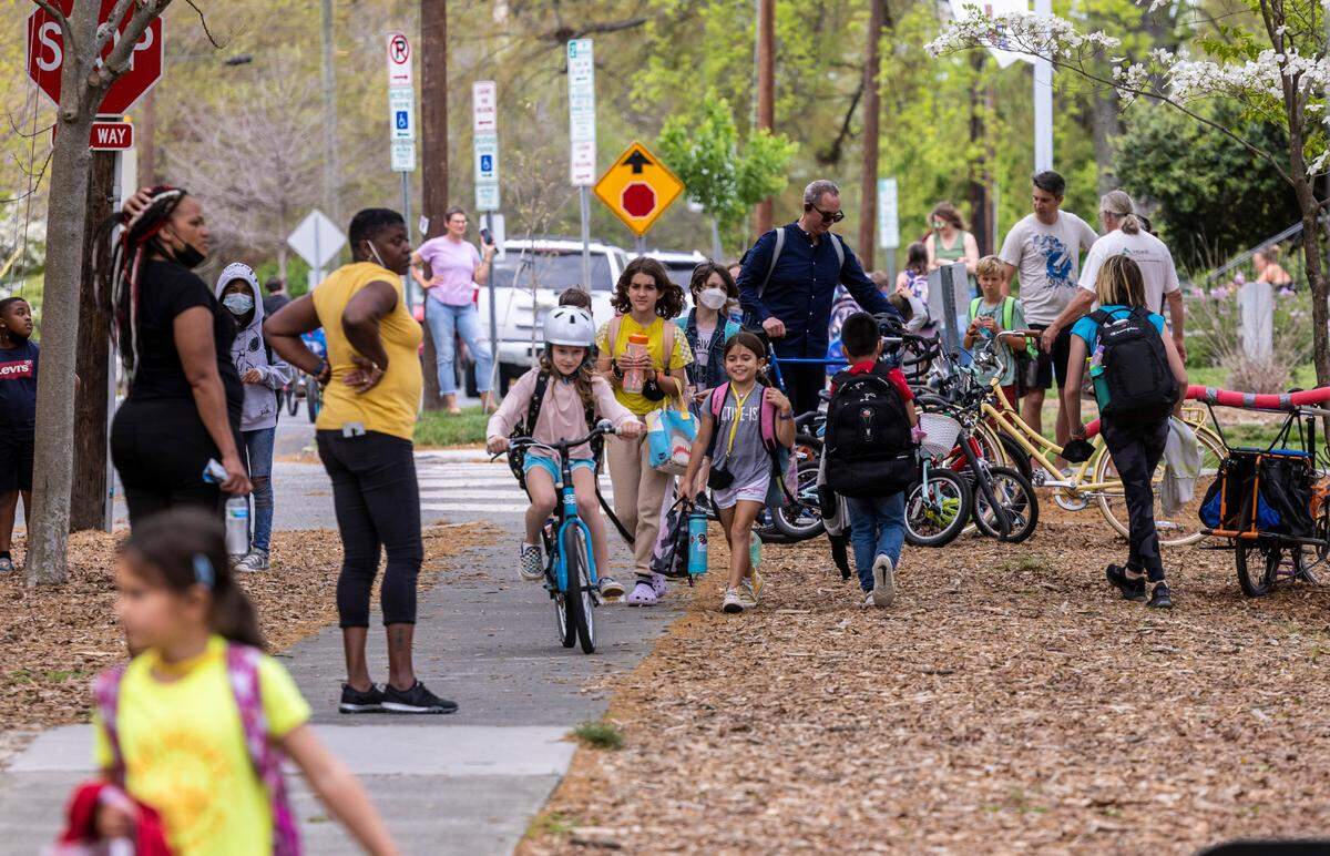Students are dismissed from George Watts Elementary School in Durham Tuesday, April 12, 2022. Durham’s public school system will begin using a new model for assigning students to schools in the 2023-24 school year, in an attempt to increase equity.