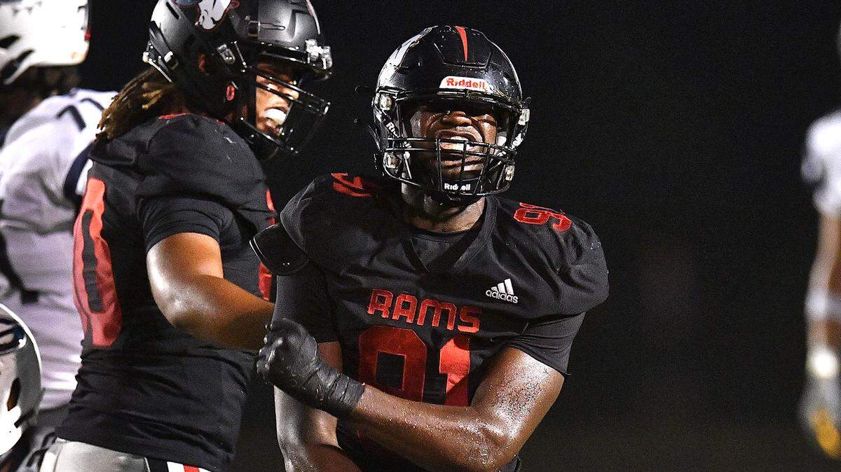 Rolesville defensive end Jayden Fry (91) reacts to a play against Grimsley during the first half. The Rolesville Rams and the Greensboro Grimsley Whirlies met in a non-conference football game in Rolesville, N.C. on August 30, 2024.