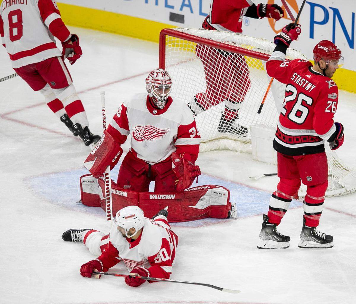 Carolina Hurricanes’ Paul Stastny (26) reacts after a goal by teammate Brent Burns (8) on Detroit’s Alex Nedeljkovic (39) in the second period on Tuesday, April 11, 2023 at PNC Arena in Raleigh, N.C.
