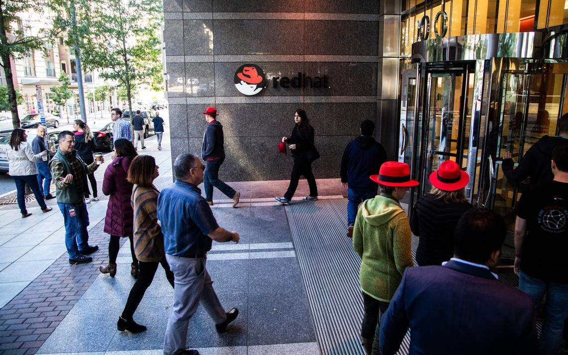 Red Hat employees walk back to their Raleigh headquarters after a meeting at the Duke Energy Center for the Performing Arts Monday, Oct. 29, 2018. IBM will acquire the Raleigh-based software maker in a $34 billion deal, the two companies announced Sunday.
