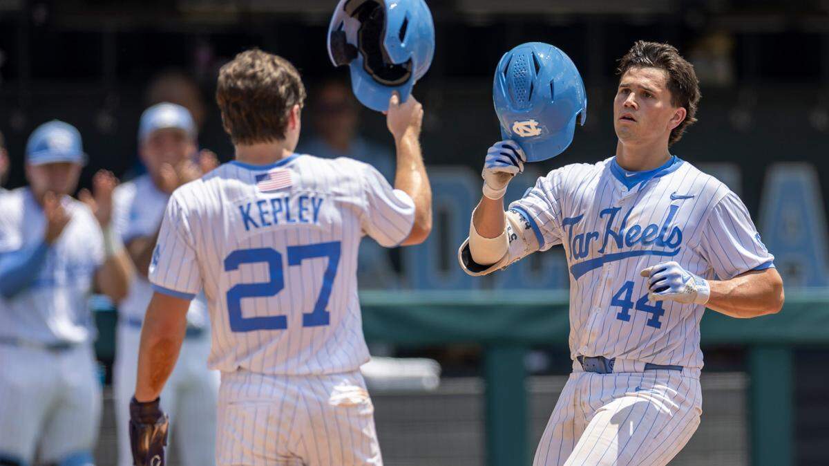 North Carolina catcher Luke Stevenson (44) is greeted at home plate after connecting for a 3 RBI home run in the second inning to take an 8-1 lead over Arizona during the NCAA Super Regional on Friday, June 6, 2025 at Boshamer Stadium in Chapel Hill, N.C.