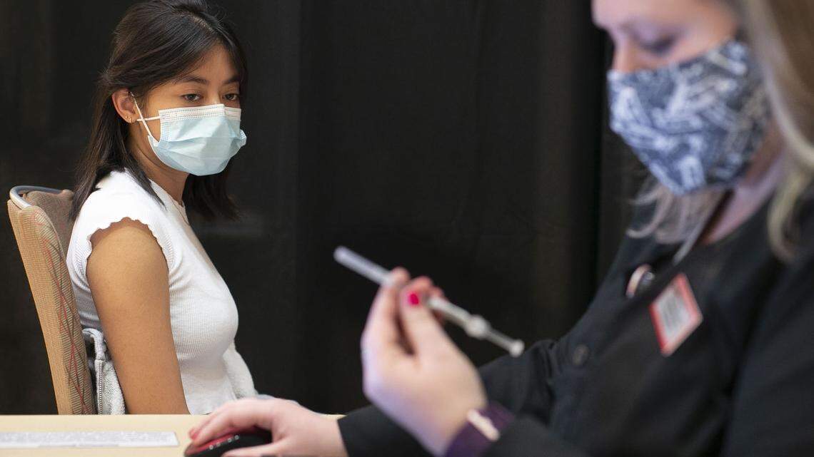 NC State student Isabella Reyes waits to receive her Johnson & Johnson COVID-19 vaccination from Teresa Shaffer, a CCMA with Student Health Services, during a immunization clinic at NC State University’s Talley Student Union on Wednesday, March 24, 2021 in Raleigh, N.C. The clinic will deliver 150 doses of the vaccine daily to students and staff.
