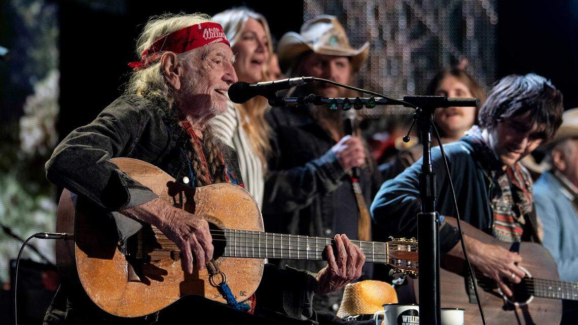 Willie Nelson is joined on stage by other performers for the finale at Farm Aid at Raleigh, N.C.’s Coastal Credit Union Music Park at Walnut Creek, Saturday, Sept. 24, 2022.